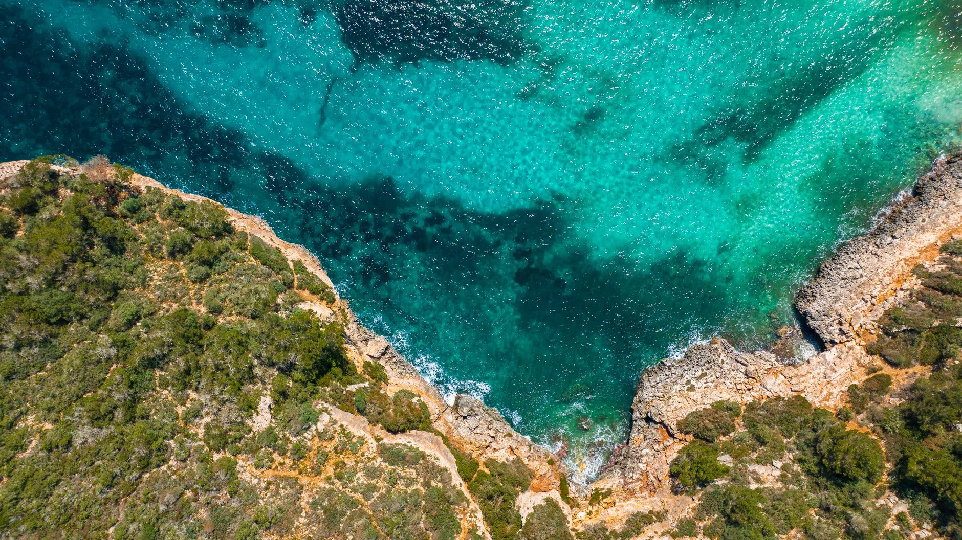 A turquoise cove between cliffs in Mallorca