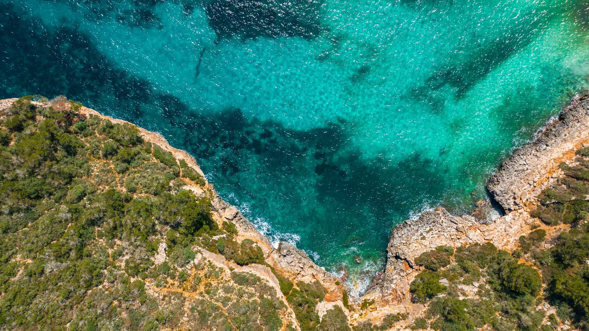 A turquoise cove between cliffs in Mallorca